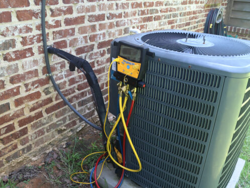 An AC system getting a maintenance check in Nashua, NH